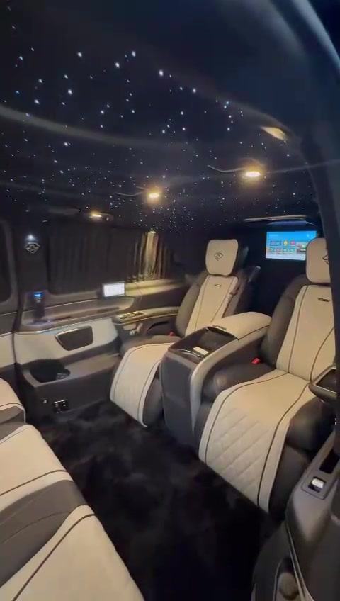 Quilted captain’s chairs beneath a starlight headliner