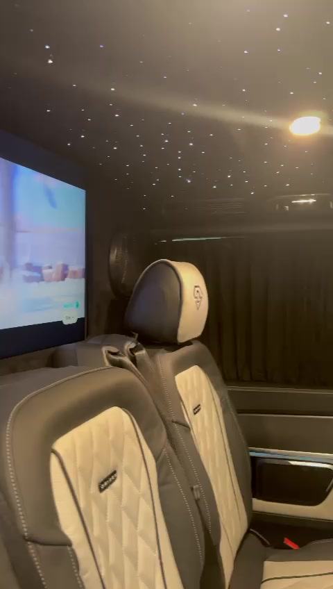 Seat-back entertainment screens and curtained windows